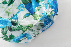 Bomullskjole med blomstertrykk og rysjer