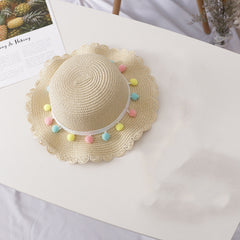 Liten ball i ensfarget stråhattveske for barn